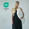 A woman is holding a white pillow. Produktbild-Vorschau