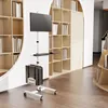 A mobile computer workstation with a monitor, keyboard, and computer tower is shown in a room with bookshelves. Voir les images du produit