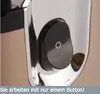 A close-up of a black button with a white circle on a silver appliance. Produktbild-Vorschau