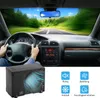 Inside a car driving on a sunny road with trees and blue sky, with a mini air cooler placed in the foreground and four icons with text below. Podgląd zdjęcia produktu