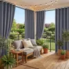 A cozy balcony setup with outdoor curtains, seating, plants, and string lights. Náhled obrázku produktu