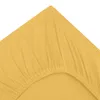 A close-up of a yellow fitted sheet, showing the elasticated edge and fabric texture. Produktbild-Vorschau