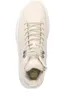 A top-down view of a beige high-top sneaker with white laces and a white sole. Produktbild-Vorschau