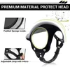 A close-up marketing image of a black pet helmet with text overlays highlighting its features. Produktbild-Vorschau