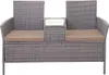 A poly-rattan bench with a central table and cushions, shown against a white background. Anteprima dell’immagine prodotto