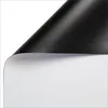 A black projection screen is partially unrolled, revealing a white surface underneath. The image is isolated on a white background. Produktbild-Vorschau