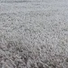 A close-up view of a beige, high-pile rug. Produktbild-Vorschau