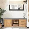 A shoe cabinet with a cushioned top, placed in a hallway or entryway. Produktbild-Vorschau