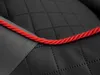 A close-up of a quilted black and gray dog bed with a red cord accent. Produktbild-Vorschau