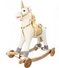 A white plush unicorn rocking horse with gold accents and wooden rockers, set against a white background. Podgląd zdjęcia produktu