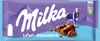 A Milka Luflee Alpenmilch chocolate bar wrapper with a cow and mountains depicted. Produktbild-Vorschau