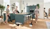 A collage of images showing a woman using a cordless vacuum cleaner in a modern kitchen and living room setting. Náhled obrázku produktu