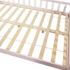 Close-up view of a wooden slatted bed base with a pink frame. Anteprima dell’immagine prodotto