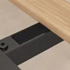 A close-up view of a black metal frame with a piece of wood attached, showing a black velcro strip. Náhled obrázku produktu