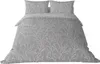 A bedding set with a branch pattern is displayed on a white background. Produktbild-Vorschau