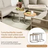 A set of nesting coffee tables on a patio with outdoor furniture. Produktbild-Vorschau