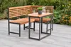 An outdoor seating set with a corner bench and a table on a patio, surrounded by plants. Produktbild-Vorschau