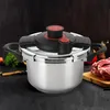 A close-up studio shot of a silver pressure cooker with black and red accents, set against a dark, textured background. Ingredients like raw meat and vegetables are visible in the background. Náhľad obrázku produktu