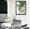 A modern kitchen counter with a framed diamond painting of a plant hanging on the wall. Podgląd zdjęcia produktu