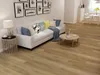 A living room scene with a sofa, coffee table, and flooring. Produktbild-Vorschau