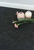 Two vases and flowers on a dark gray carpet. Produktbild-Vorschau