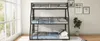 A black metal triple bunk bed with blue bedding is set up in a room with large windows and some wall art. Podgląd zdjęcia produktu