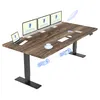 A wooden standing desk with multiple monitors, a laptop, and a coffee cup. Produktbild-Vorschau