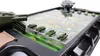 A close-up shot of a board game with miniature tanks on a battlefield map. Náhled obrázku produktu