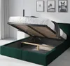A green upholstered bed frame with the mattress and slatted base lifted to reveal the storage compartment underneath. Produktbild-Vorschau