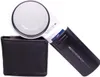 A handheld magnifying glass with an LED light and a protective case, presented against a white background. Podgląd zdjęcia produktu