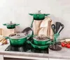 A collection of green cookware set with lids and kitchen utensils arranged on a countertop. Produktbild-Vorschau