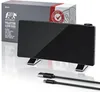A black projection alarm clock with its packaging and charging cables on a reflective white surface. Produktbild-Vorschau