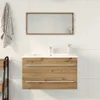 A bathroom vanity with a sink and mirror mounted on a tiled wall. Produktbild-Vorschau