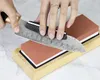 A person sharpening a knife on a whetstone. Podgląd zdjęcia produktu