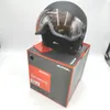 A black Alpina ski helmet with a visor sits on top of its packaging box. Anteprima dell’immagine prodotto
