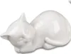A white ceramic cat figurine lying down on a white background. Produktbild-Vorschau