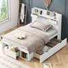 A white bed with storage drawers in a room with a window and a ladder. Podgląd zdjęcia produktu