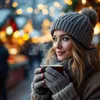 A woman in winter clothing holding a mug of hot beverage at a festive outdoor market. Produktbild-Vorschau