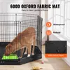 A dog inside a metal dog crate with a black fabric mat and a green food bowl. Voir les images du produit