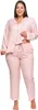 A woman is posing in a pink pajama set. Produktbild-Vorschau