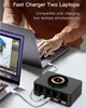A person is using a fast charger hub to charge two laptops simultaneously, with a wireless charging pad on top. Produktbild-Vorschau