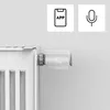 A smart radiator thermostat attached to a radiator, with icons indicating app and voice control. Náhľad obrázku produktu