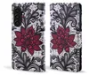 A flip-style phone case with a floral lace pattern. Produktbild-Vorschau