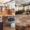 A collage of four different interior design scenes, including a kitchen, a dining area, a living room, and a bedroom. Produktbild-Vorschau