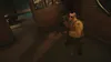 A person in military-like attire is crouching in a dimly lit room. Produktbild-Vorschau
