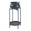 A dark gray metal plant stand with a matching pot and a lower shelf, shown against a white background. Podgląd zdjęcia produktu