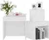 Two white side tables are shown, one with a vase of tulips and a tea set, the other with books and picture frames. Náhled obrázku produktu