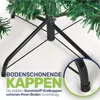 Close-up of the base of an artificial Christmas tree, highlighting the protective caps on its legs. Produktbild-Vorschau