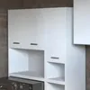 A white bathroom cabinet set with a washing machine underneath, set against a tiled wall. Náhled obrázku produktu