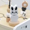 A close-up shot of a wooden baby walker toy, focusing on a white bunny-shaped block and beads. Produktbild-Vorschau